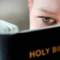 Boy Reading the holy bible